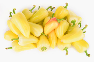 Fototapeta na wymiar Yellow peppers isolated on white