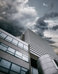 Modern office center building with apocalyptic sky