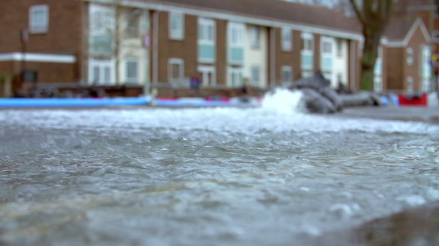 Slow Motion Sequence Of Pumping Water From Flooded Road 