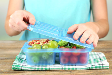 Woman making tasty vegetarian lunch, close up