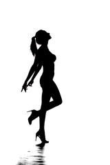 silhouette of the whole body of a woman standing on one leg