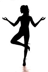Fototapeta na wymiar silhouette of the whole body of a woman standing on one leg