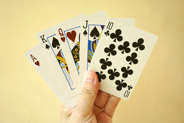 Hand with playing cards