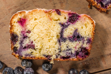 Slice of blueberry coffee cake loaf with blueberries