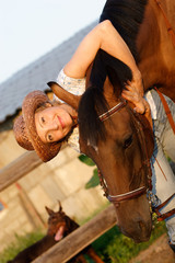 woman embrace brown horse