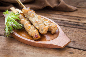 Grilled pork on wooden plate