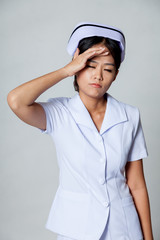 Young Asian nurse got headache