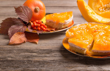 pumpkin and pie on wooden table