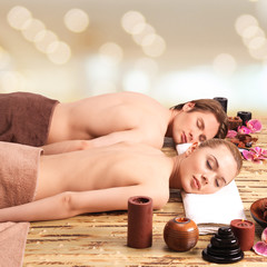 Obraz na płótnie Canvas Couple lying on the massage desks.