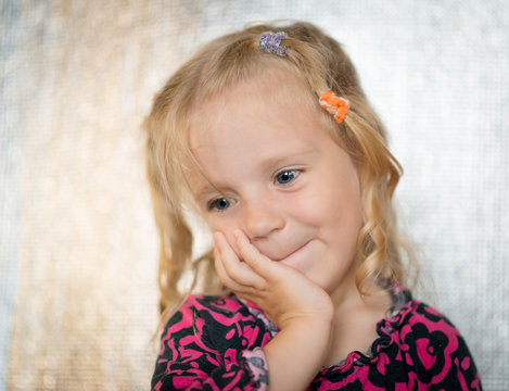 Cute little girl over bright background.
