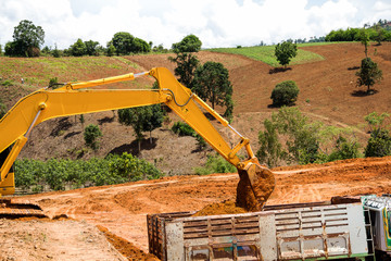 Backhoe loader loading dumper