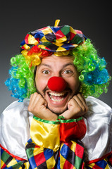 Funny clown in colourful costume