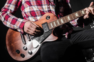 Man with guitar during concert