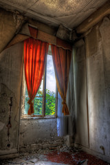 Desolate window in an abandoned house