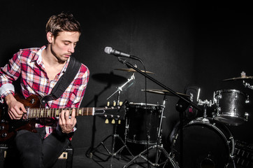 Man with guitar during concert