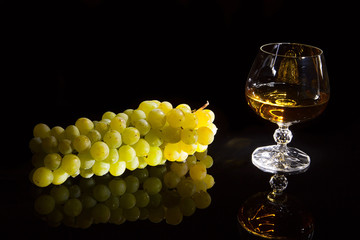 Brandy glass and grapes