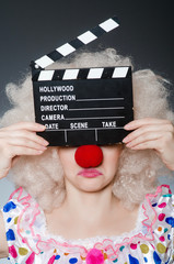 Clown with movie clapper board