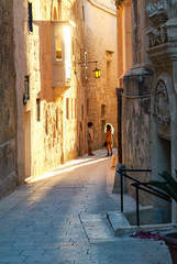 street of mdina kisses by the ray of sun at sunset