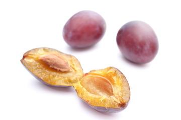 Fresh and natural plums on a white background
