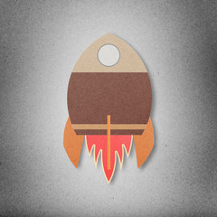 Obraz premium Space rocket flying in space cut paper craft on paper background