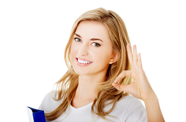 Happy woman with ok hand sign