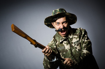 Funny soldier against the dark background