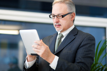 Businessman using a tablet