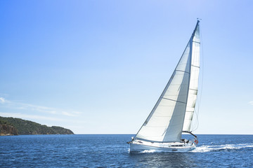 Fototapeta na wymiar Sailing, racing yachts on the high seas. Luxury yachts.