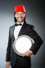Waiter wearing traditional turkish hat