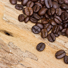 Coffee beans on wood background