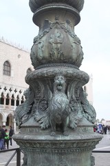 Fototapeta na wymiar Doge's Palace Venice - Venetian winged Lion street lamp