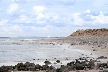 Fototapeta na wymiar bulk tanker at rocky beal beach