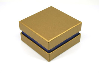 Golden gift box isolated on white