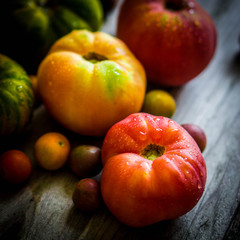 Heirloom tomatoes on rustic background