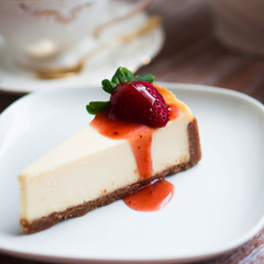 Strawwberry cheesecake on rustic background