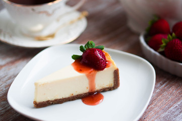 Strawwberry cheesecake on rustic background