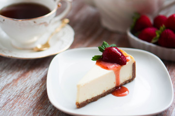 Strawwberry cheesecake on rustic background