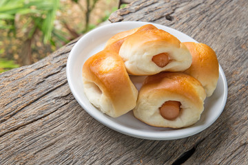 sausage in the bread on wood table