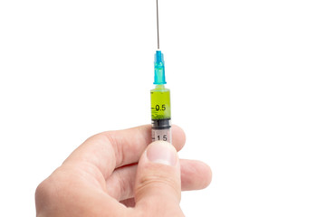 Syringe with the vaccine in hand - Stock Image