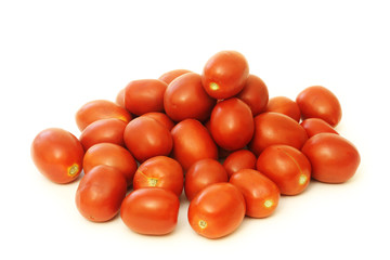 A lot of red tomatoes on a white background