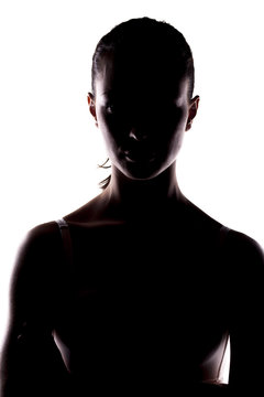 Portrait Of A Woman With The Face In Shadow On White Background