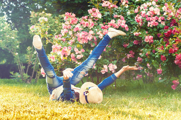 Happy funny child having fun on the grass. Messing around.