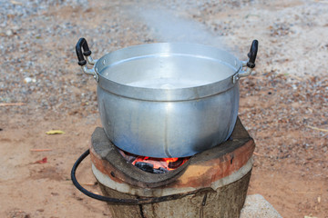 Cooking on Traditional Stove with with Fire Charcoal.