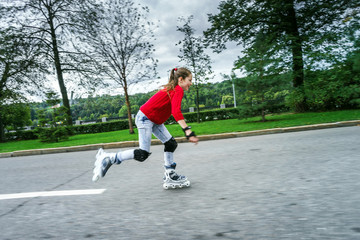 Beautiful teenage girl roller-skating