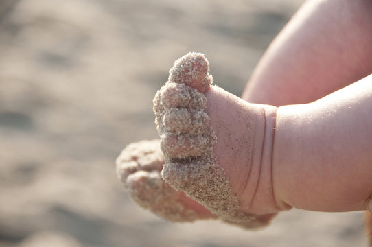 Sandy baby feet