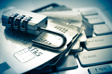 open security lock on credit cards with computer keyboard