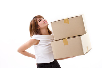 unhappy woman carrying heavy box with back pain