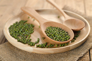 Mungbeans with wooden plate and wooden spoon