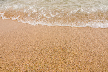 Fototapeta na wymiar Wave of the sea on sand beach