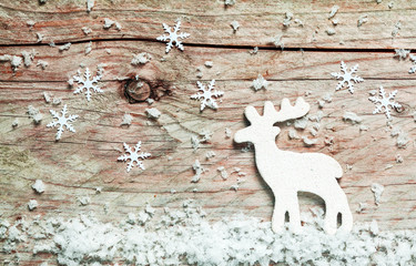 Christmas background with a reindeer in snow